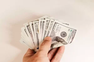 A person depositing an investment to start an infinite banking policy