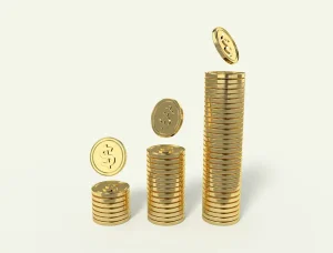 Stacks of increasingly tall gold coins with the dollar symbol on it
